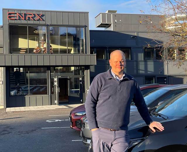 Mark Andrus outside ENRX headquarters, illustrating ENRX’s role in advanced induction bonding technology for the automotive industry.