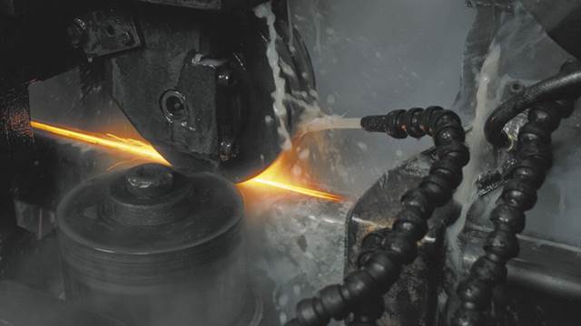 ENRX high‑frequency induction welding creating a longitudinal weld seam on a steel tube with cooling spray