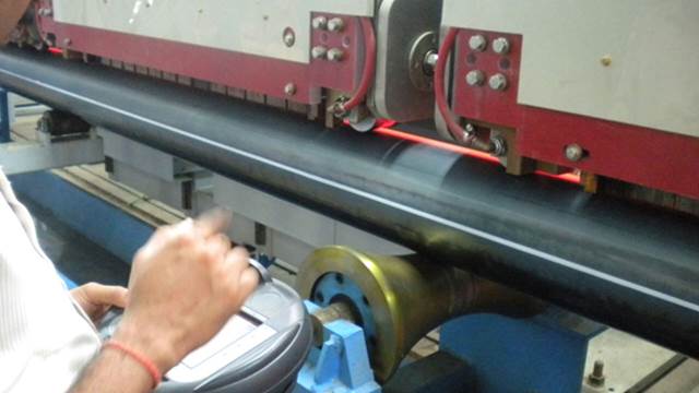 ENRX induction heating system performing seam normalising on steel pipe during inline tube production