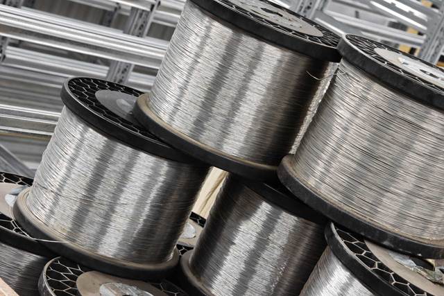 Steel wire coils used in wire and cable production with induction heating for controlled processing