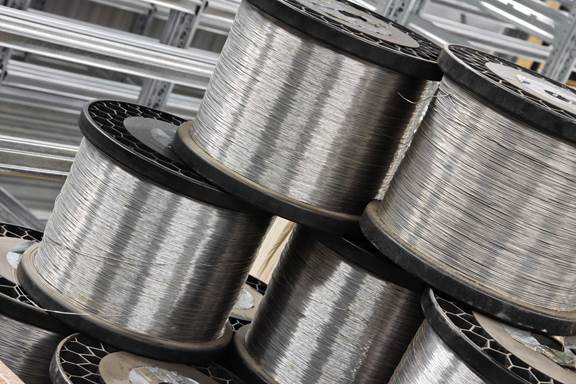 Steel wire coils used in wire and cable production with induction heating for controlled processing