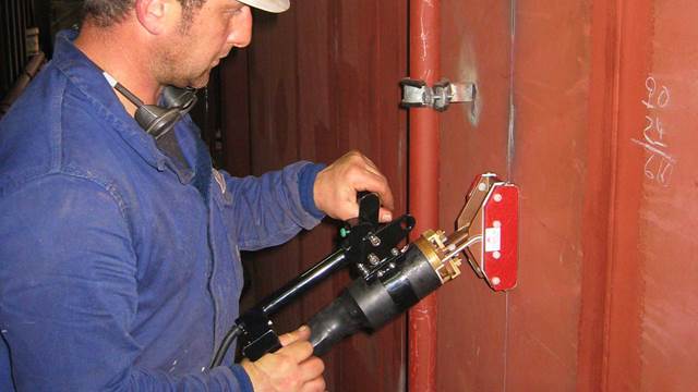 ENRX Terac induction heating tool used to straighten ship deck steel plates during marine repair     