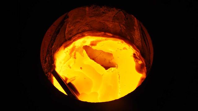 Molten metal inside an induction furnace used for industrial metal melting