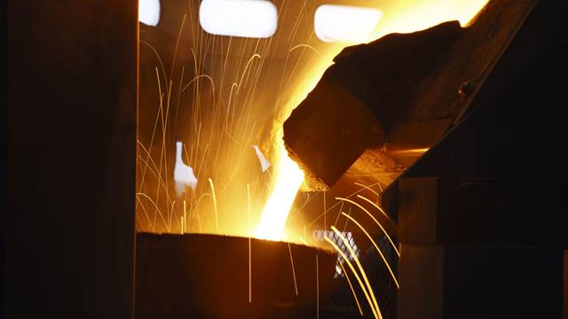 Molten metal being poured in a foundry where ENRX induction heating is used for efficient and controlled melting processes