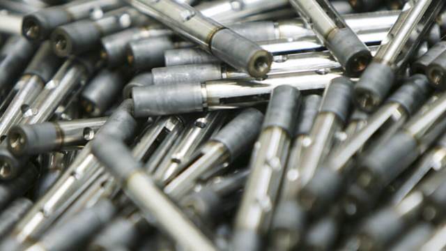 Small metal parts prepared for ENRX induction heat treatment in industrial production