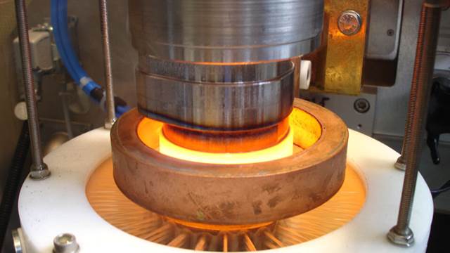 ENRX induction heat treatment system hardening a shaft with uniform heating