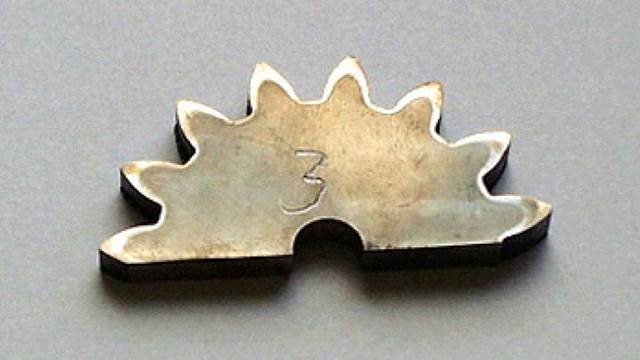 Induction‑hardened small gear component showing precise heat treatment for improved wear resistance and durability