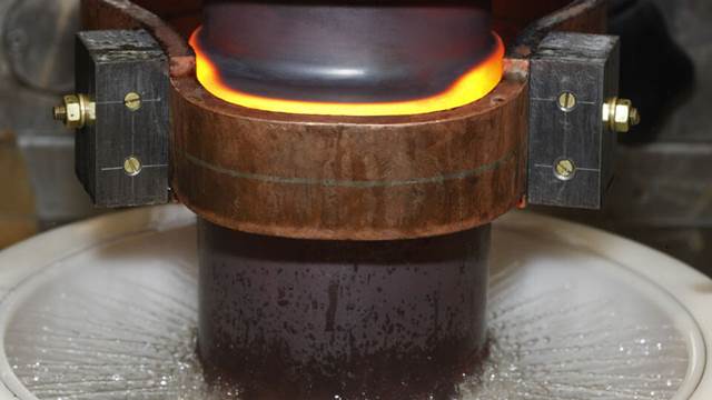 Induction heating and hardening process applied to a camshaft for superior wear resistance in automotive applications