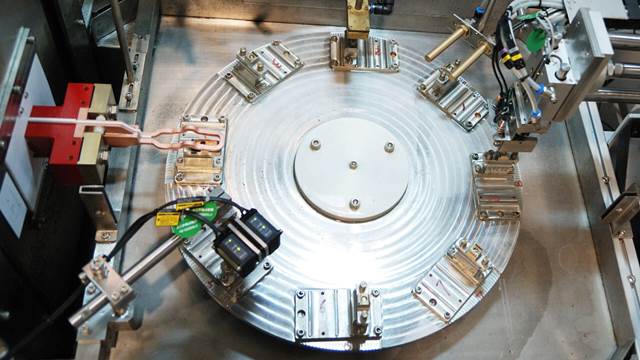 Automated ENRX induction brazing system assembling contactor components on rotary table