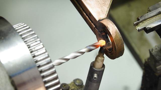 Carbide tip on a twist drill heated with ENRX induction coil for precision brazing