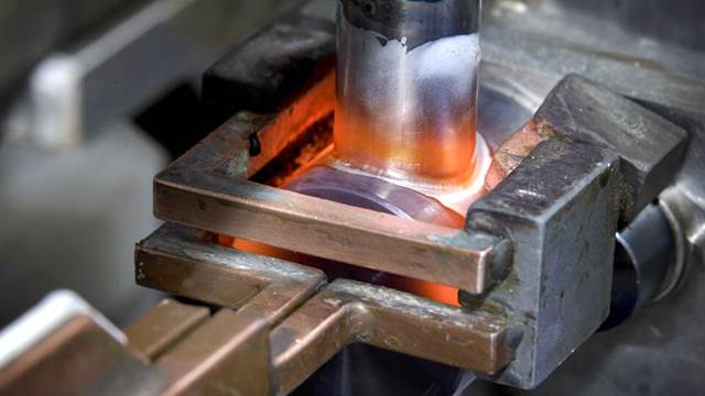 Evaporator tube connection heated with ENRX induction coil for brazing