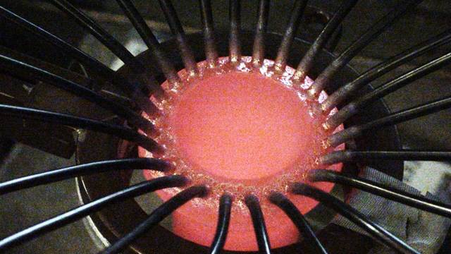 Heat distributor assembly heated with ENRX induction coil for controlled brazing