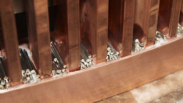 Brazing alloy rods positioned between copper stator bars for ENRX induction brazing