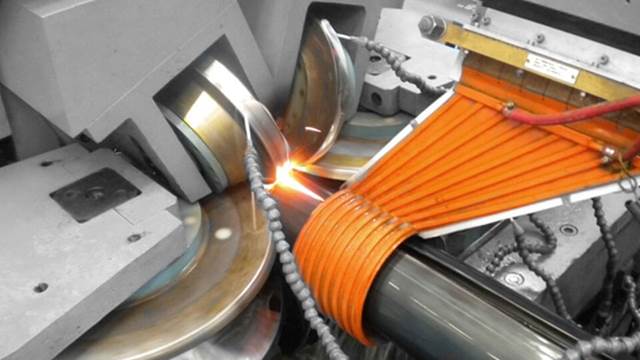 ENRX induction coil heating steel tube during high‑frequency longitudinal welding process