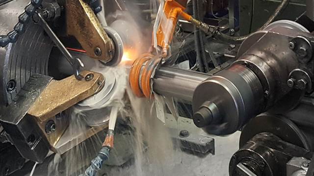 ENRX induction coil heating steel tube during high‑frequency longitudinal welding with cooling spray