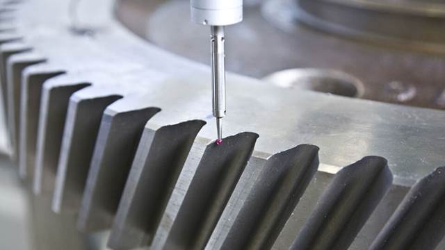 Close‑up of gear undergoing induction heating and hardening process for enhanced strength and wear resistance