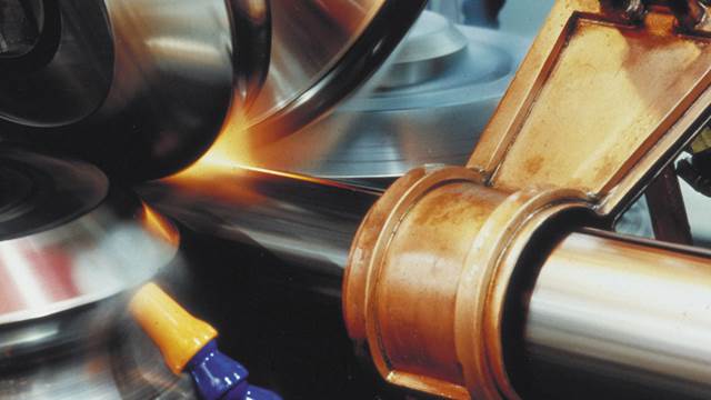 Industrial tube welding process where ENRX induction heating is used to heat the steel tube edges before high‑frequency welding