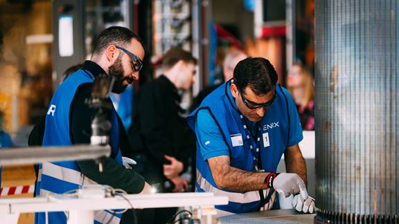 WEG engineers performing induction brazing tests using ENRX induction heating technology