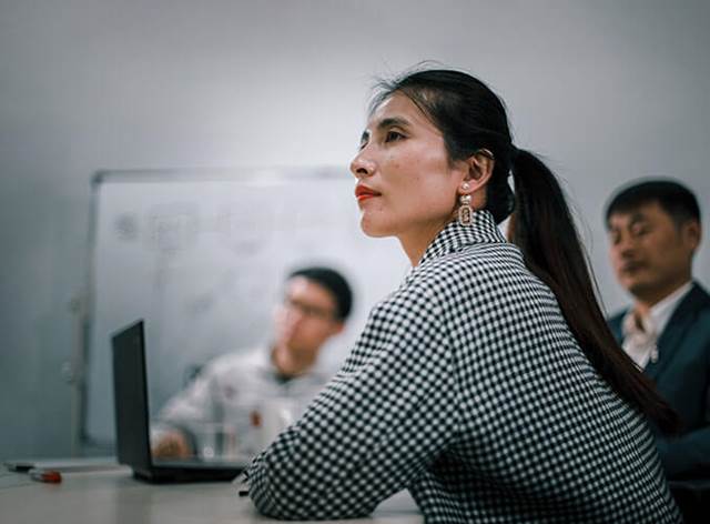 Business professionals in a meeting room, representing ENRX news and press releases