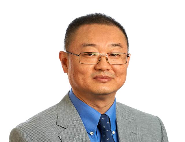 Professional portrait of ENRX’s Vice President for the Asia region, dressed in a suit against a white background.