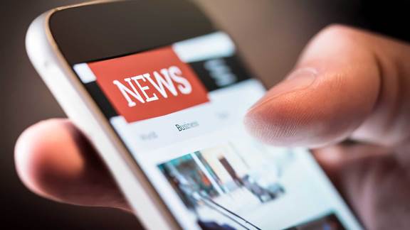 Smartphone displaying news headlines representing ENRX news and press releases