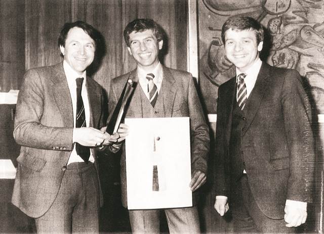 Black-and-white photo from 1982 showing the founders of ELVA Induksjon during an award ceremony, representing the early roots of EFD Induction and ENRX.