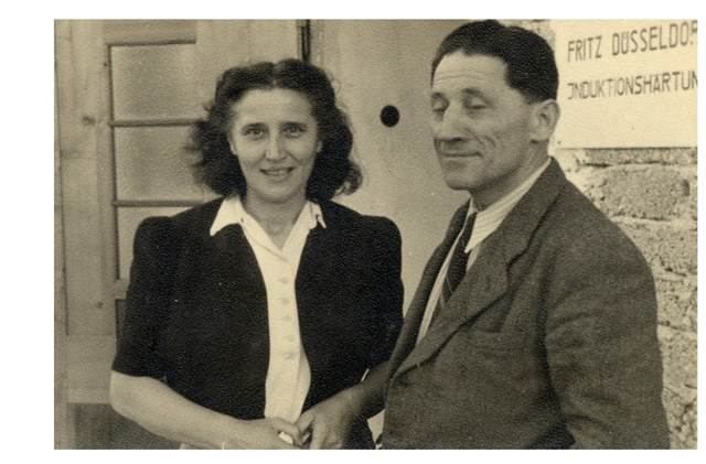 Vintage photograph of a man and woman standing together in the early years of the company that would evolve into EFD Induction and later ENRX.