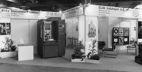 Historic induction heating equipment displayed at an industrial exhibition by Fritz Düsseldorf and Elva Induksjon