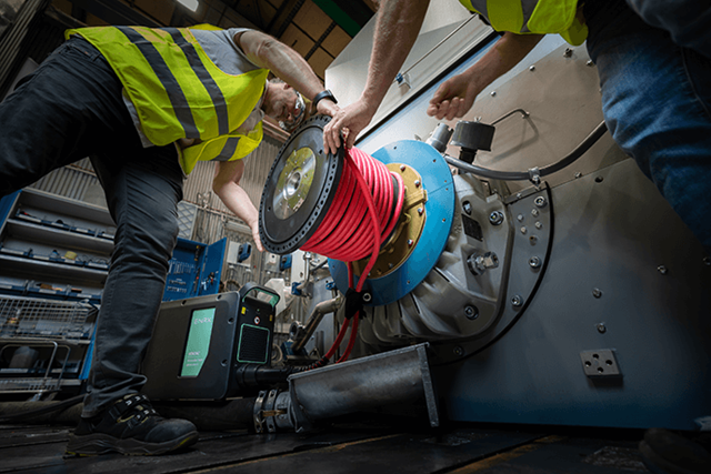 ENRX Ventac air‑cooled induction heater performing a shrink‑fitting operation on industrial machinery