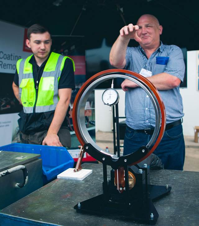 George Drury from ENRX and Scott Clive Donald from Glensol demonstrating induction heating technology in Baku
