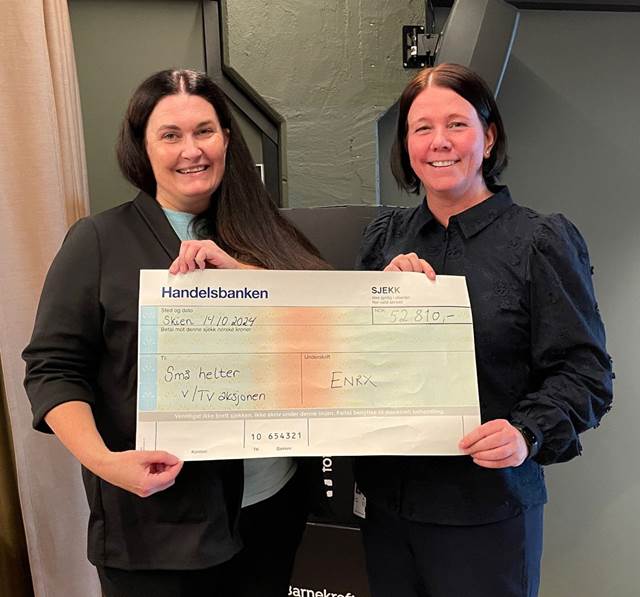 ENRX donation to Norwegian TV Telethon for children cancer patients, with Gry Solheim receiving a gift check