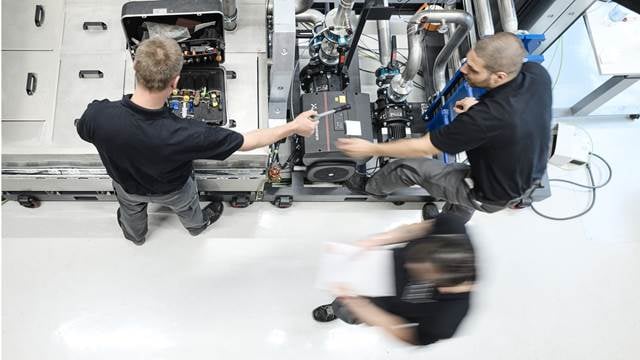 ENRX technicians performing preventive maintenance and repair work on induction heating equipment to ensure reliable system performance.