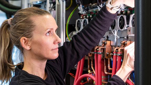 ENRX engineer performing retrofit and refurbishment work on induction heating equipment to upgrade performance and extend system lifetime.